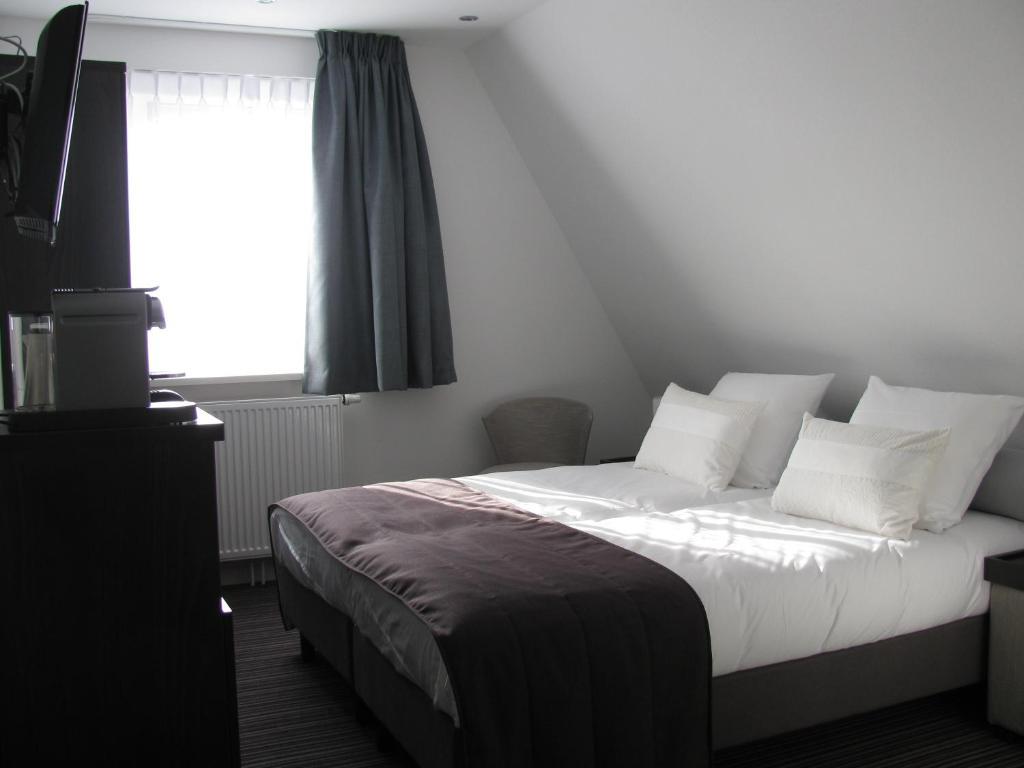 Boutique Hotel De Zwaluw De Koog  Habitación foto